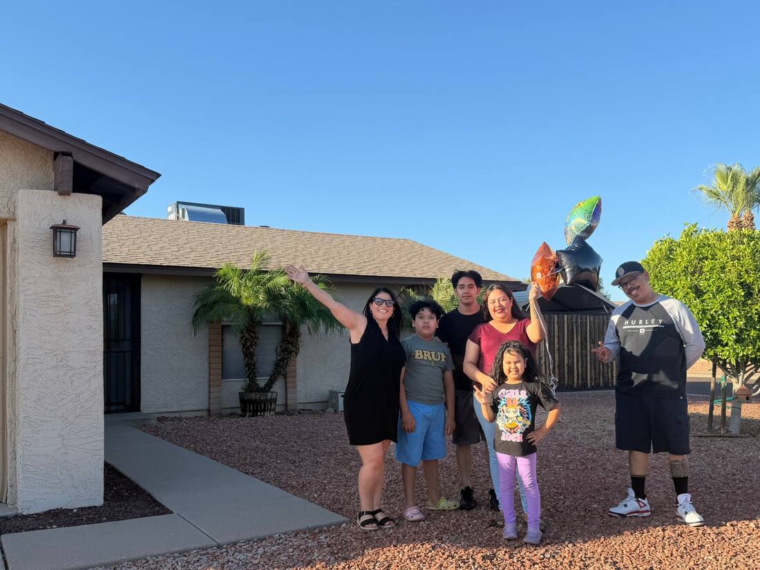 Family celebrating a home milestone